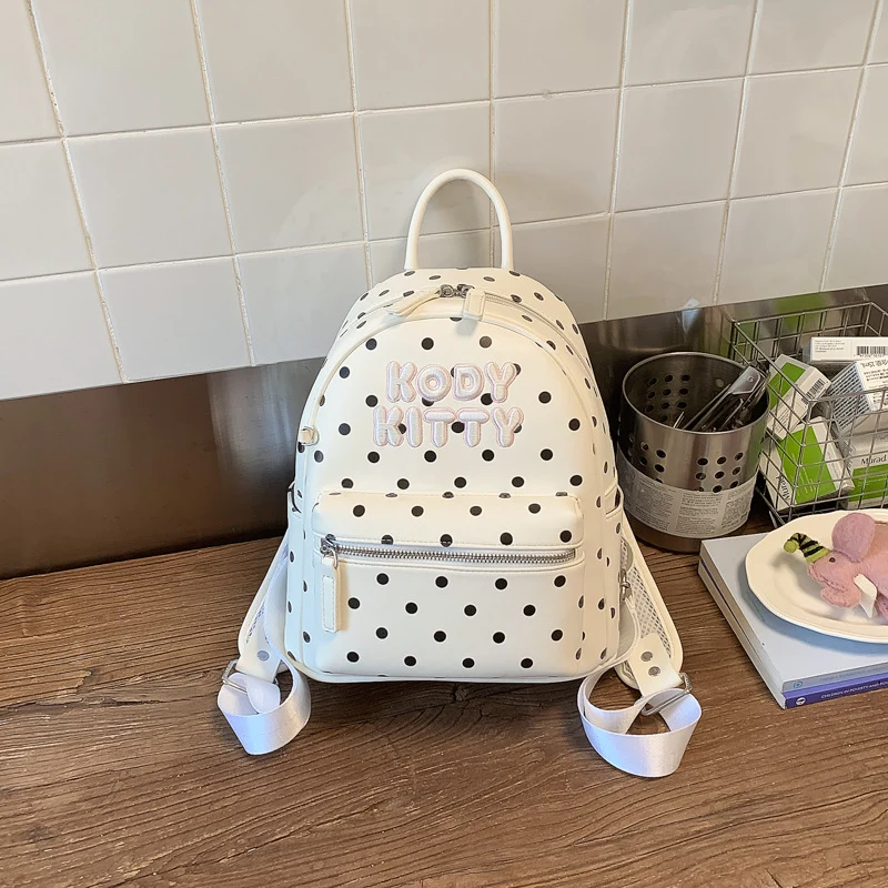Niedlicher gepunkteter Schulrucksack mit Charakter-Motiv