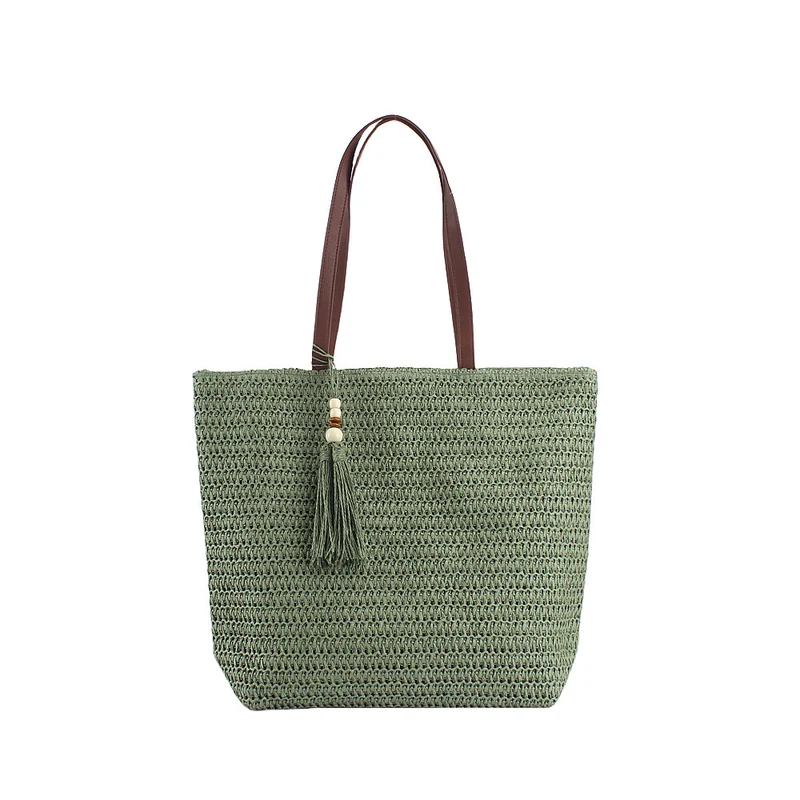 Geräumige Clutch aus geflochtenem Naturmaterial mit dekorativer Quaste Skanto