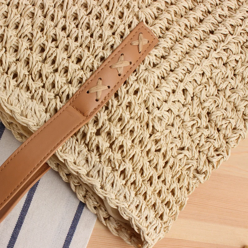 Tasche aus geflochtenem Naturmaterial mit weichen Ledergriffen Skanto