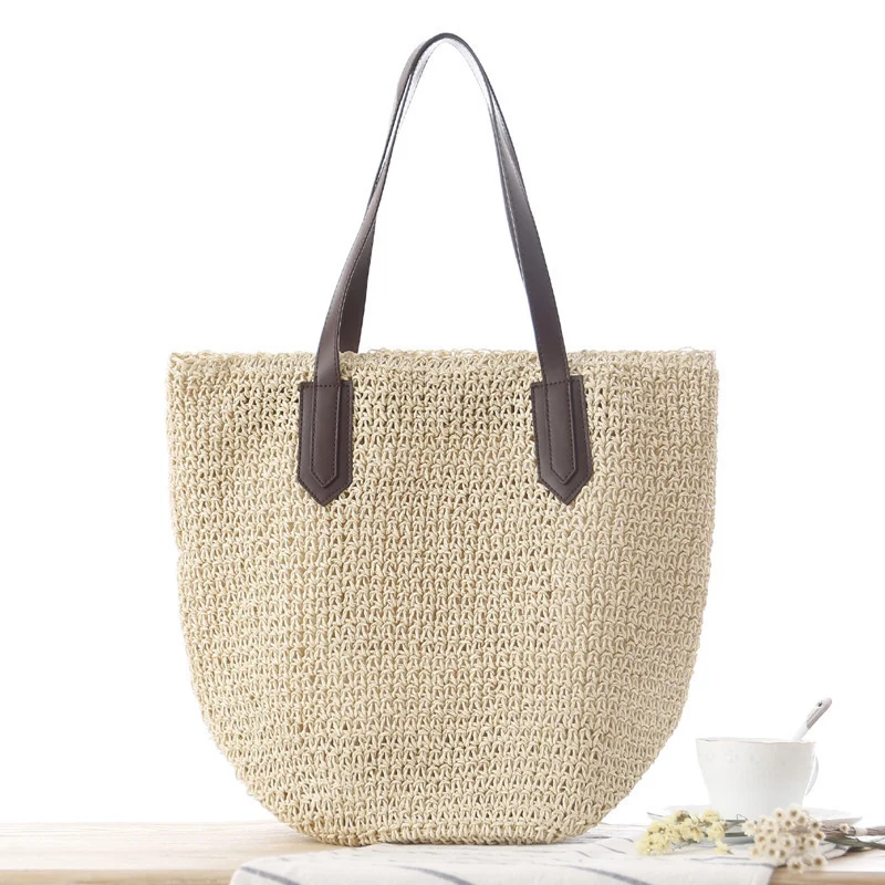 Handtasche aus geflochtenem Naturmaterial mit robusten Ledergriffen Skanto