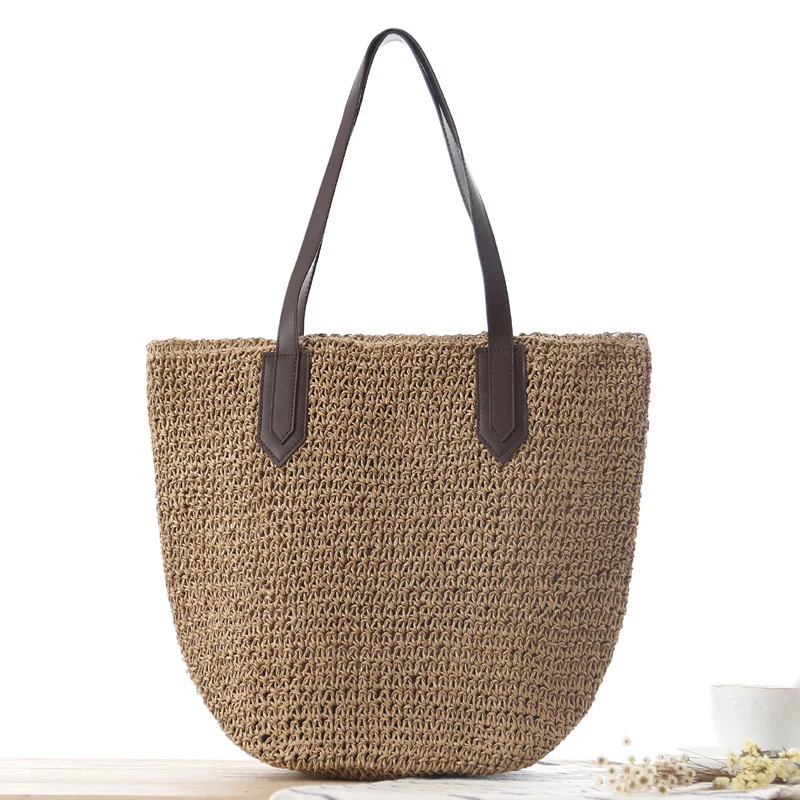 Handtasche aus geflochtenem Naturmaterial mit robusten Ledergriffen Skanto