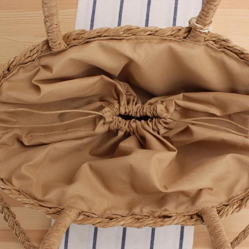Handtasche aus geflochtenem Naturmaterial mit elegantem Fransen-Detail Skanto