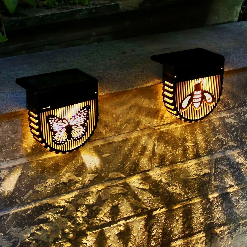 Dekorative Solar-Wandlaternen mit lasergeschnittenen Bienen- und Schmetterlingsmotiven Skanto