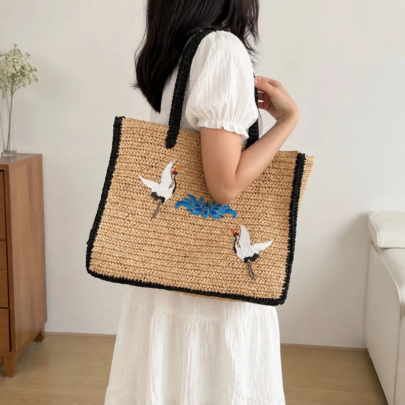 Elegante Stroh-Tote-Bag mit künstlerischem Stickdesign Skanto