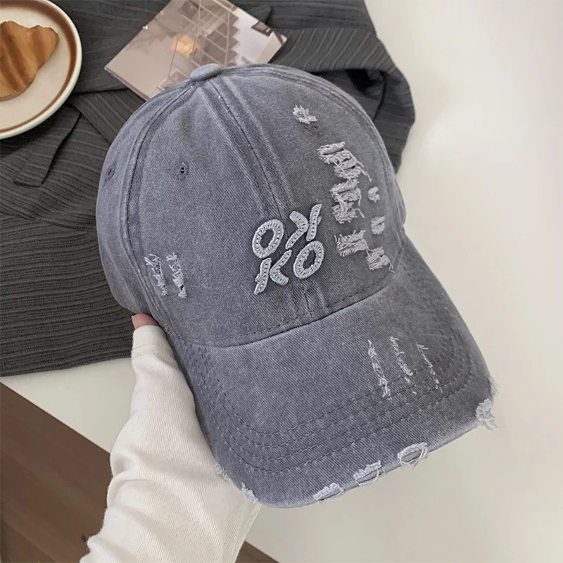 Damen Baseballkappe im Used-Look mit Grafikstickerei Skanto