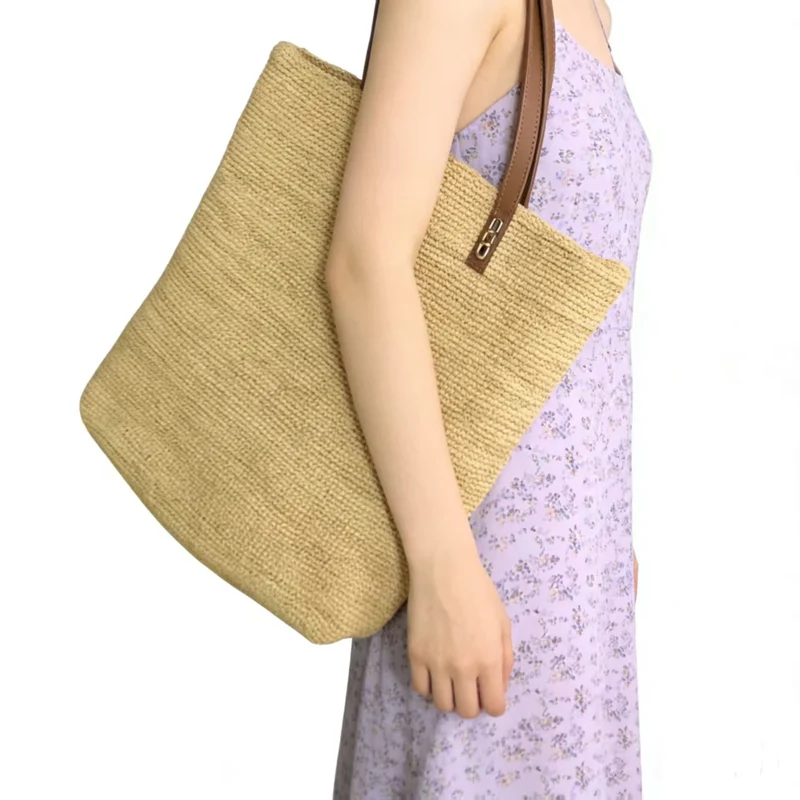 Handtasche aus nachhaltigem gewebtem Naturmaterial mit eleganten Ledergriffen Skanto