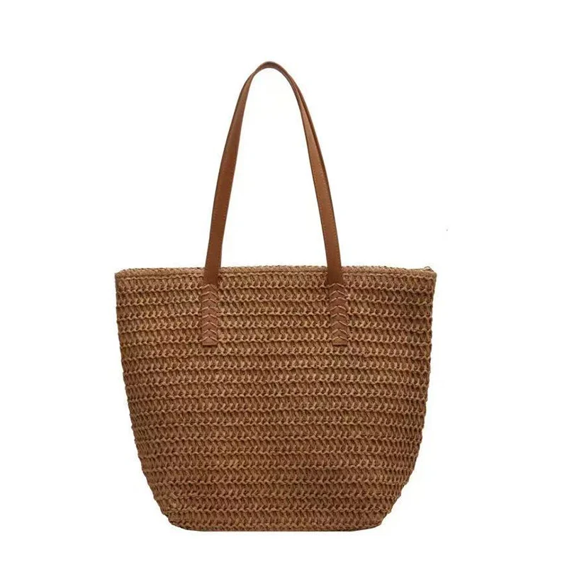 Handtasche aus gewebtem Naturmaterial mit Ledergriffen Skanto